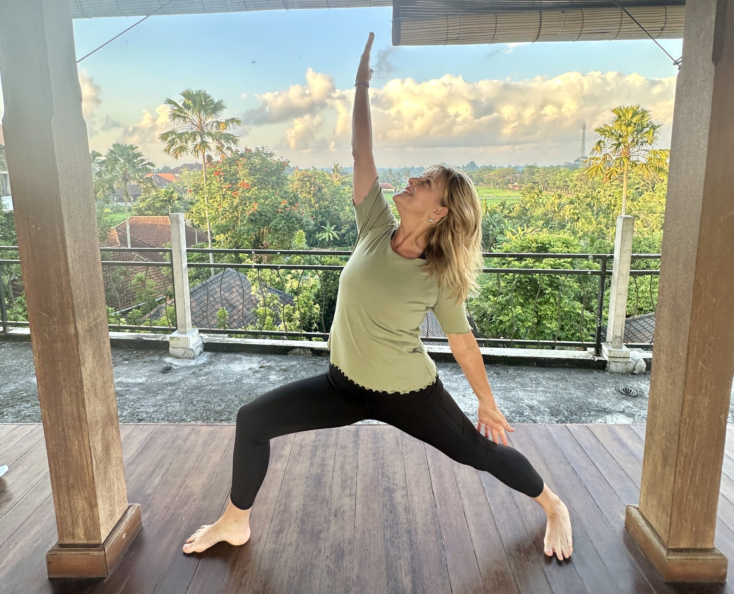 Debi Robinson in reverse warrior pose — yoga therapy for bone health